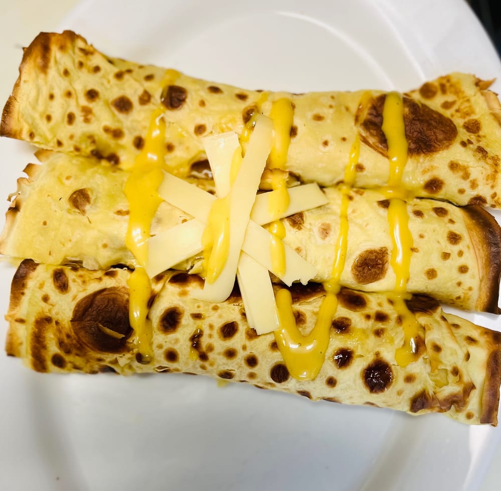 Savory ham and cheese crêpe drizzled with honey mustard