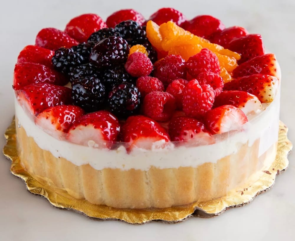 Fruit Bavarian cake topped with mixed berries